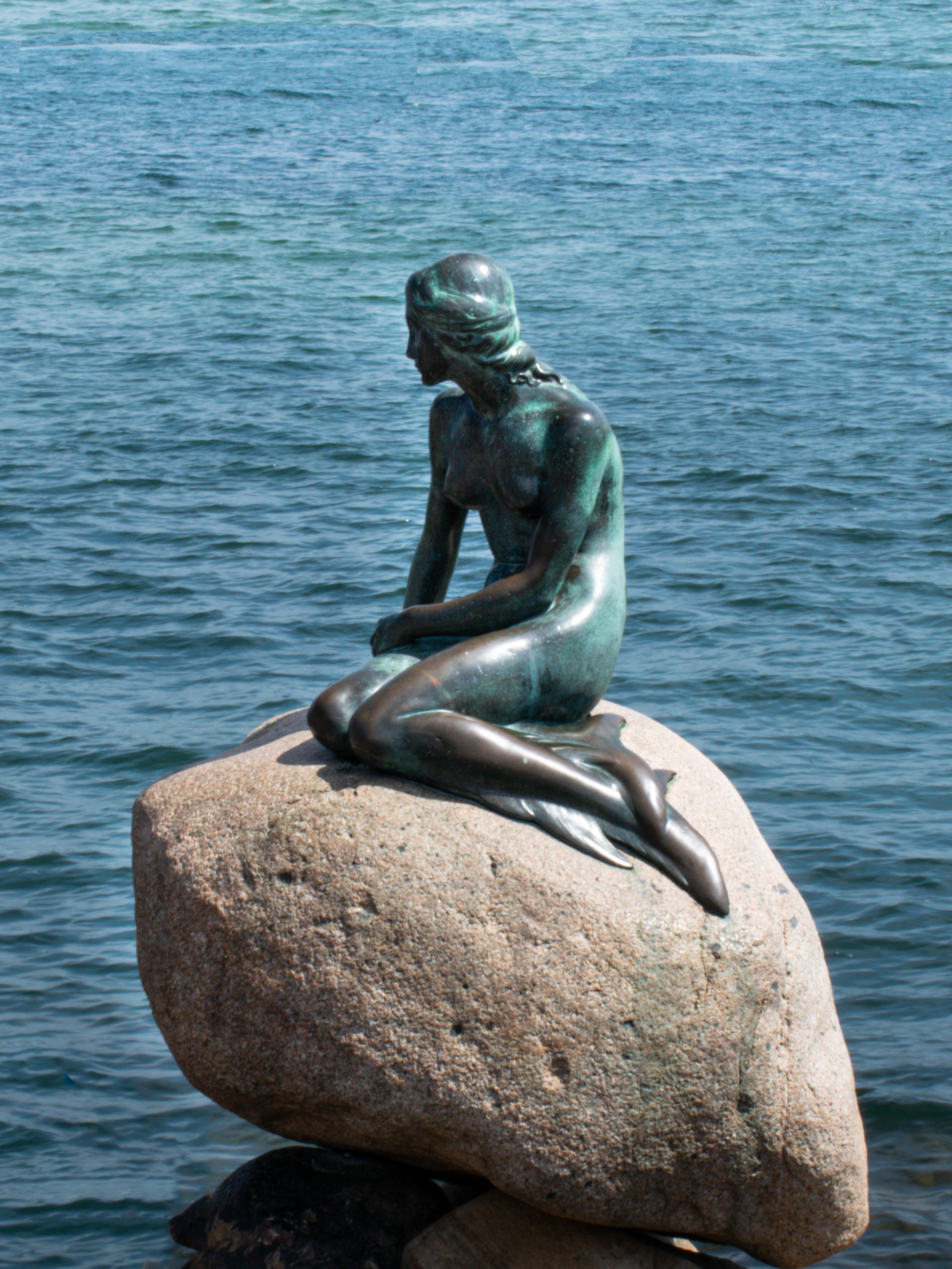 The iconic Little Mermaid statue at the harbor's waterfront in Copenhagen